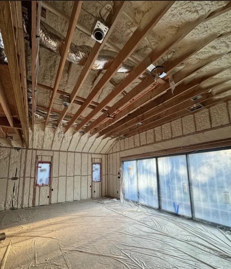 Interior walls and ceiling insulated with spray foam during new construction in Vernon